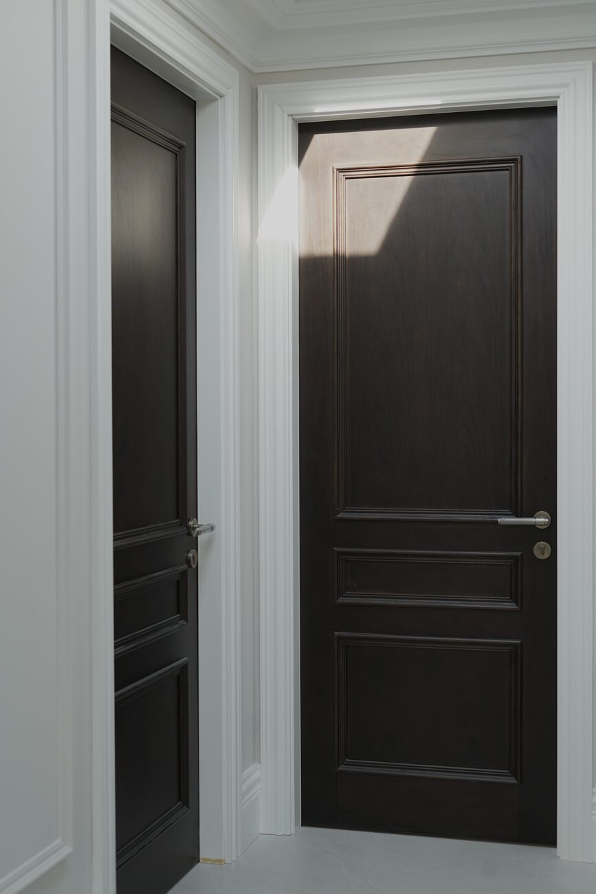 Matched panelled doors in a corridor