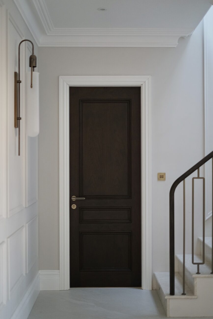 Walnut three-panel door in hallway